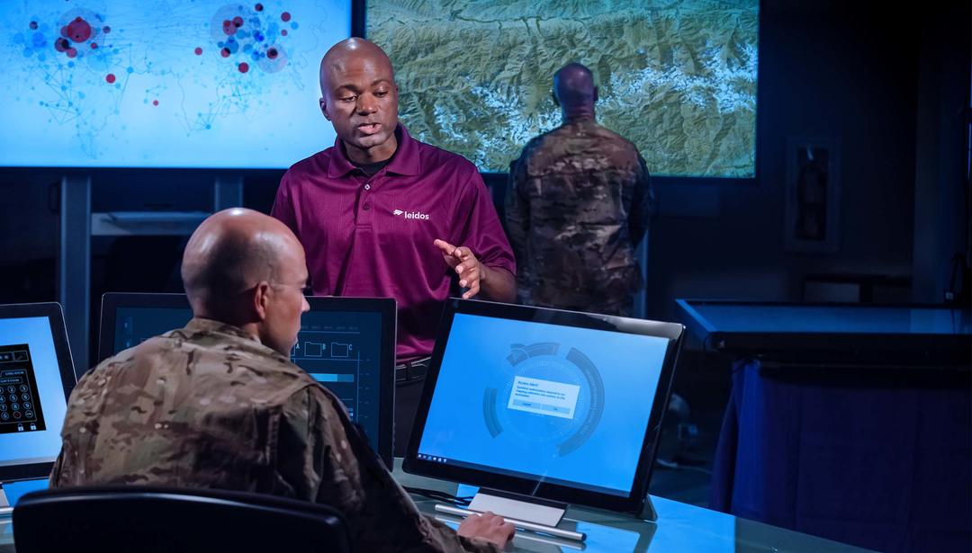 Military command and control operation with personnel looking at screens