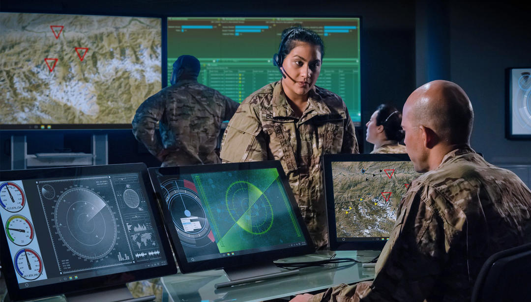 Military command and control center with female leader briefing staff