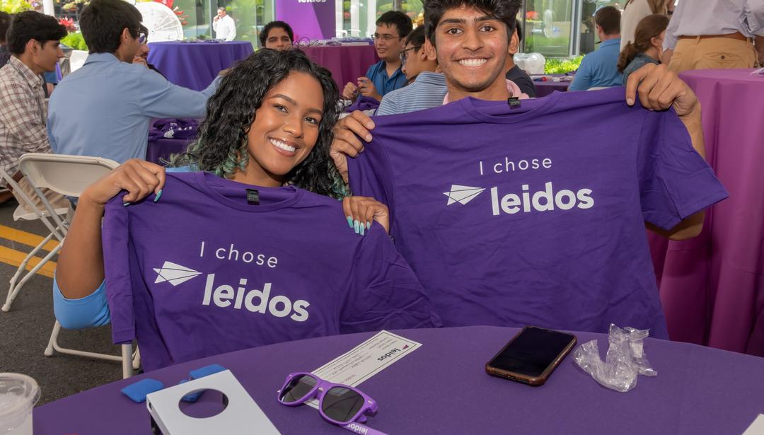 Image of two young employees with tshirts