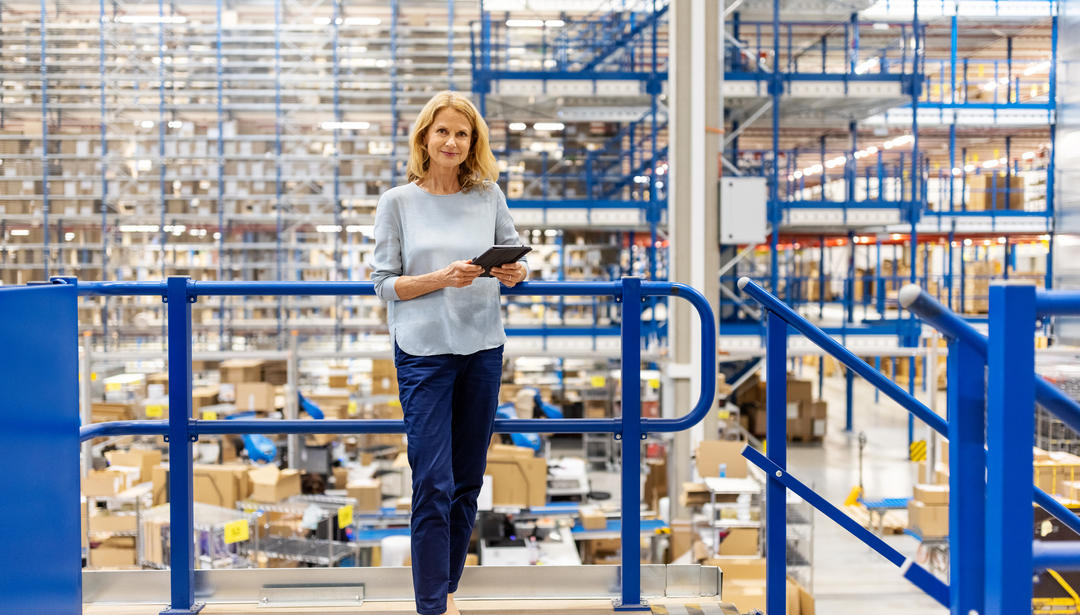 Portrait of a mature supervisor with digital tablet at warehouse