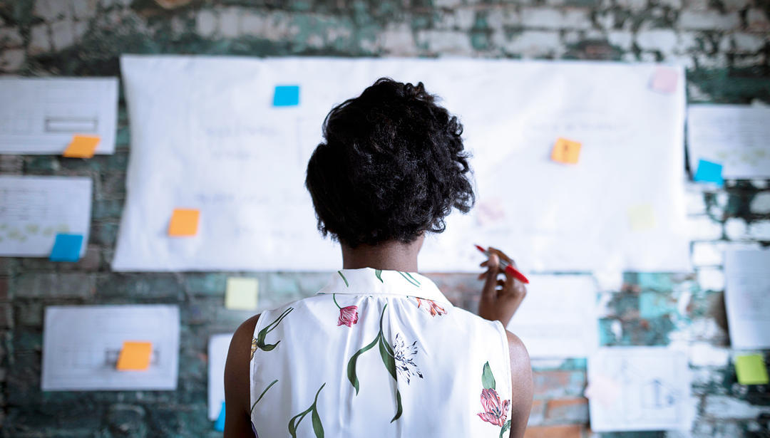 Woman looking at board