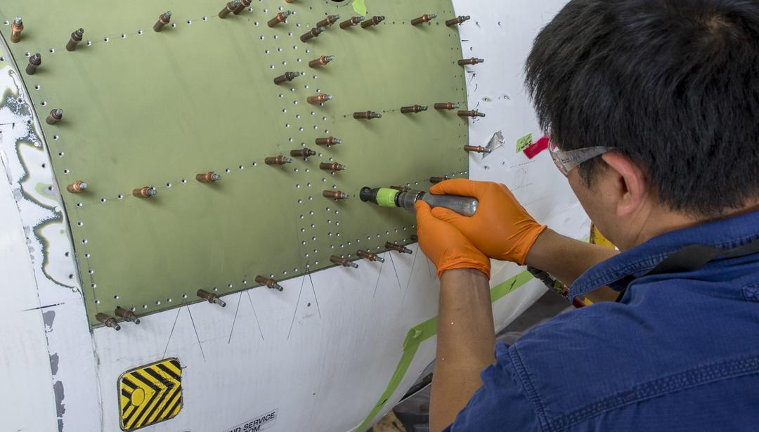 Man working on plane