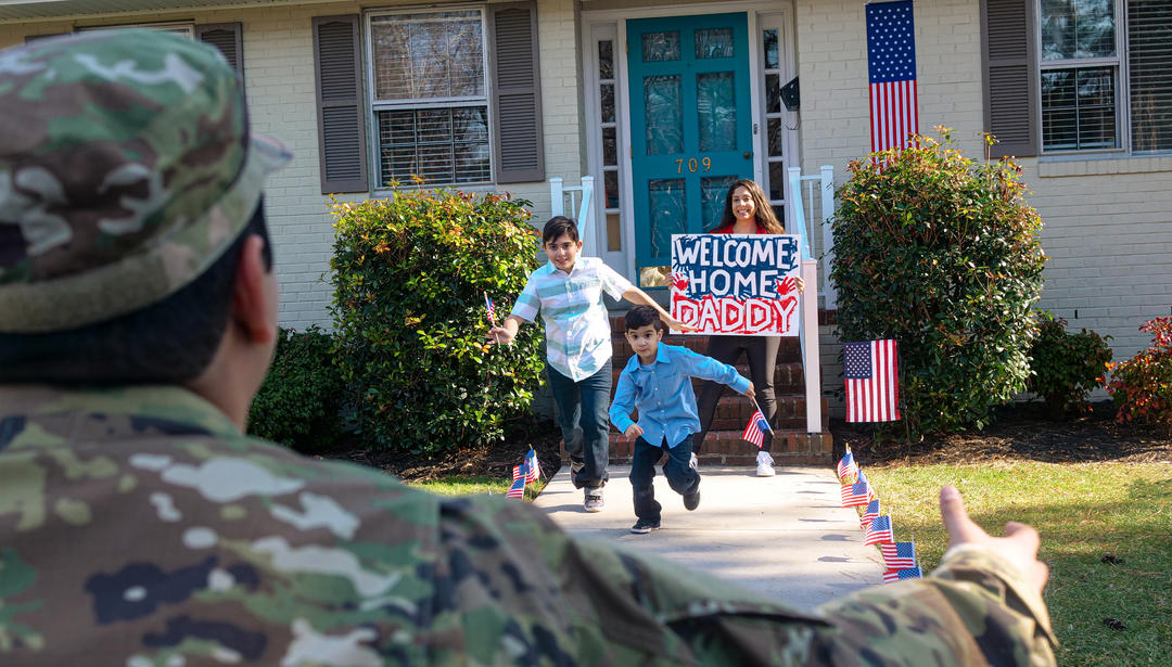 Children and wife running to father/husband