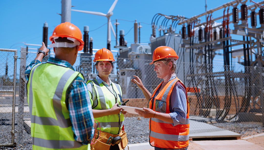 Employees inspecting utility assets