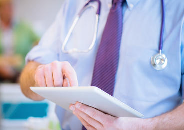 Healthcare professional using tablet