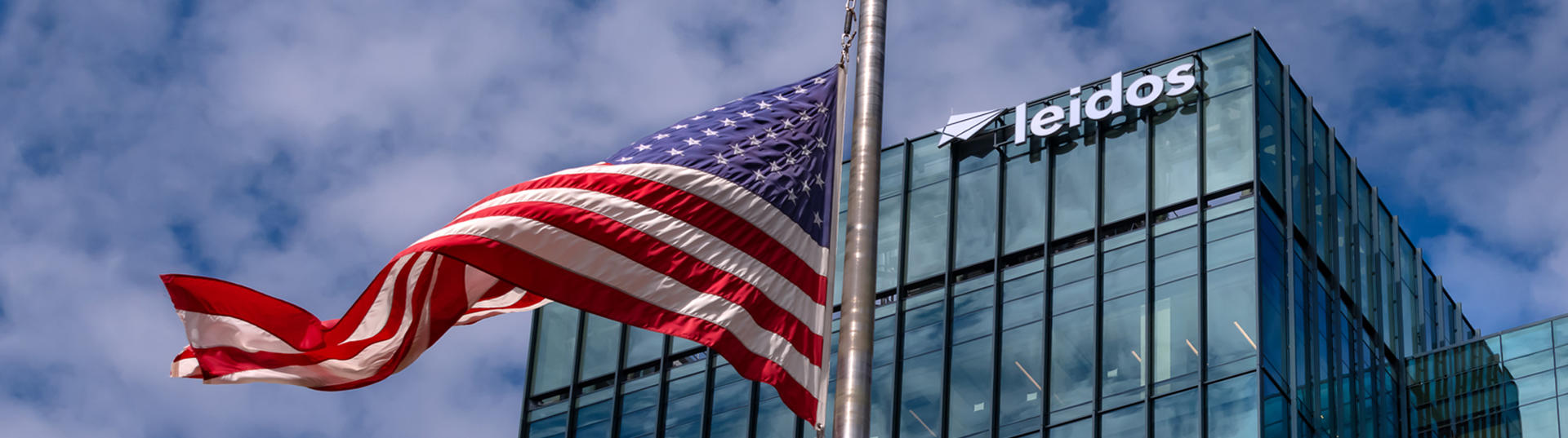 American flag flying in front of the Leidos headquarters building