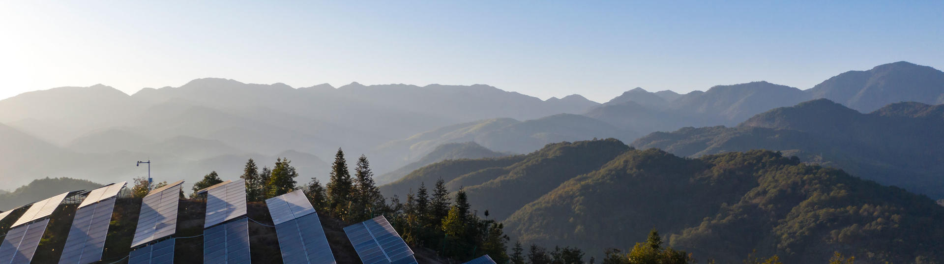 Aerial view of solar panels on a hillside