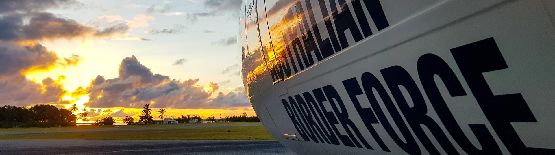 Border Force plane with sunset in the background