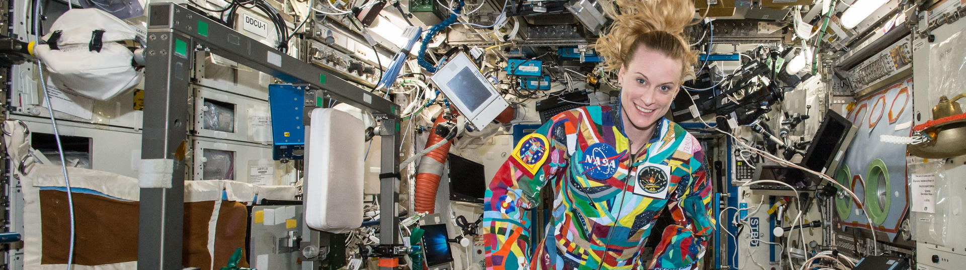Kate Rubins with colorful space suit