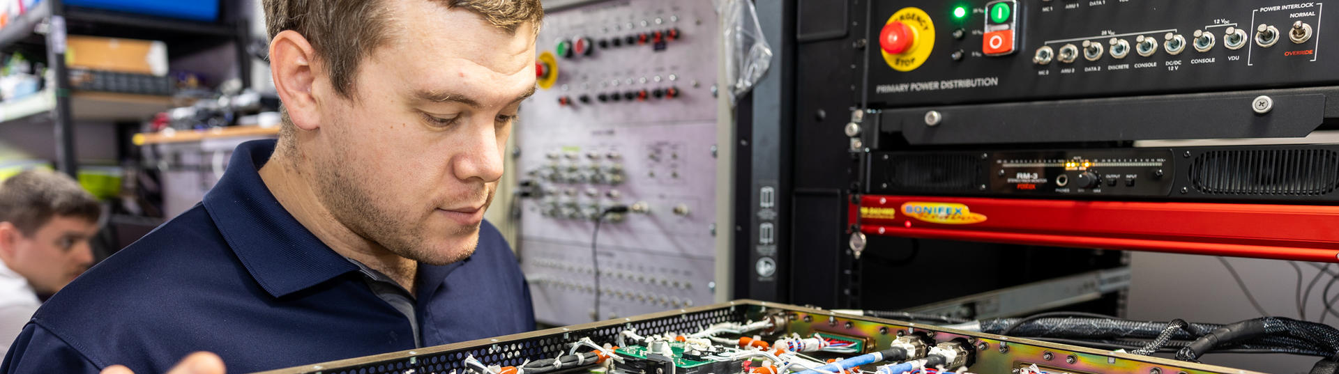 Engineer looking at some technical equipment