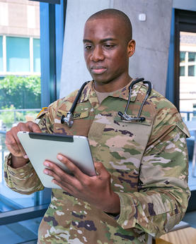 military doctor using tablet