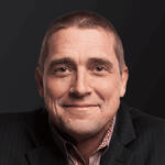 A close-up photograph of Ted Tanner