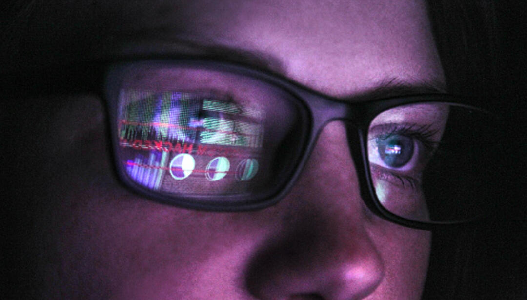 cyber professional at workstation