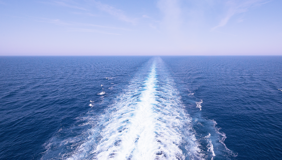 ripples in the ocean from boat moving through