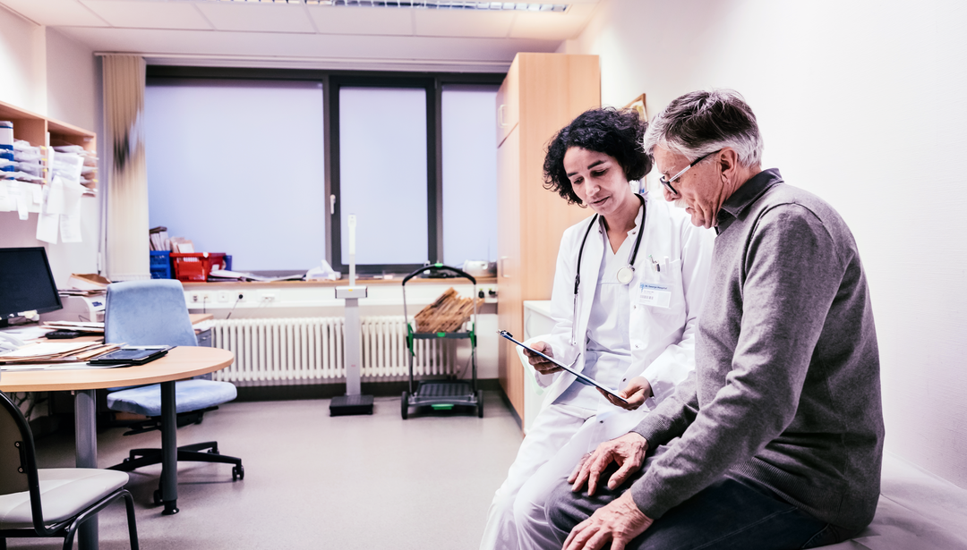 Doctor reviewing chart with patient