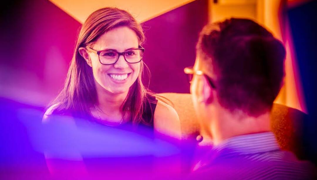 Employees having a career discussion at Leidos Australia