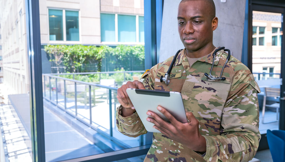 medic Soldier looking at tablet
