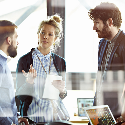 colleagues discussing something in an office environment