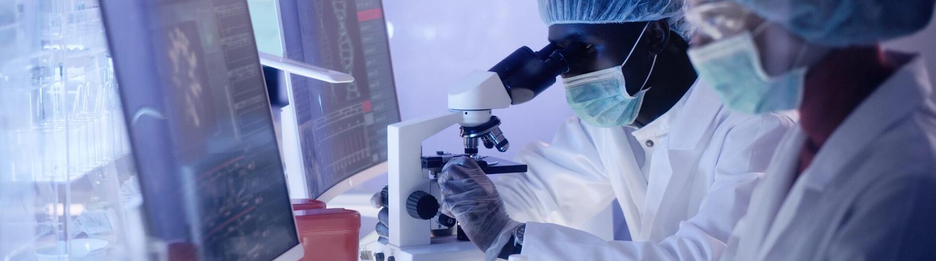 Scientists examines brainwave models in modern Neurological Research Laboratory.