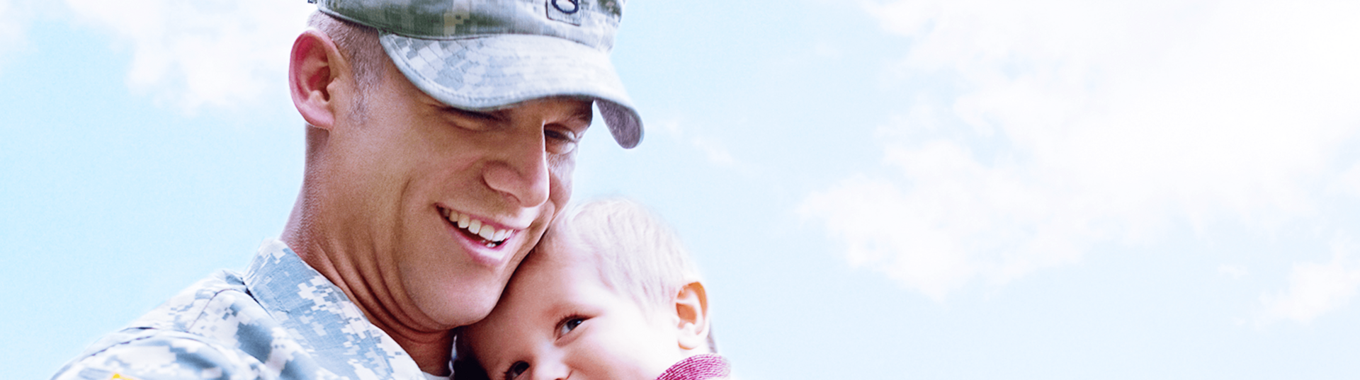 Soldier holding baby boy