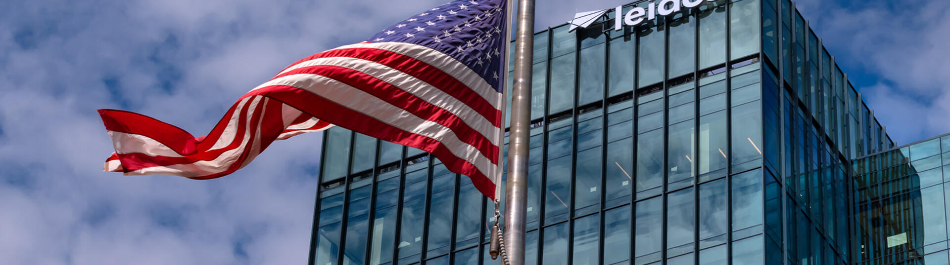 American flag flying in front of the Leidos headquarters building