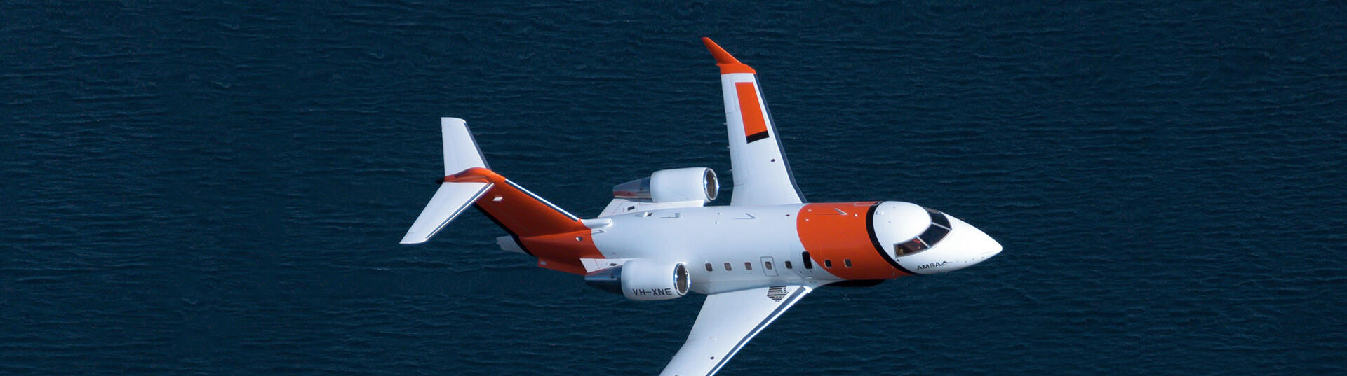 Plane flying over water