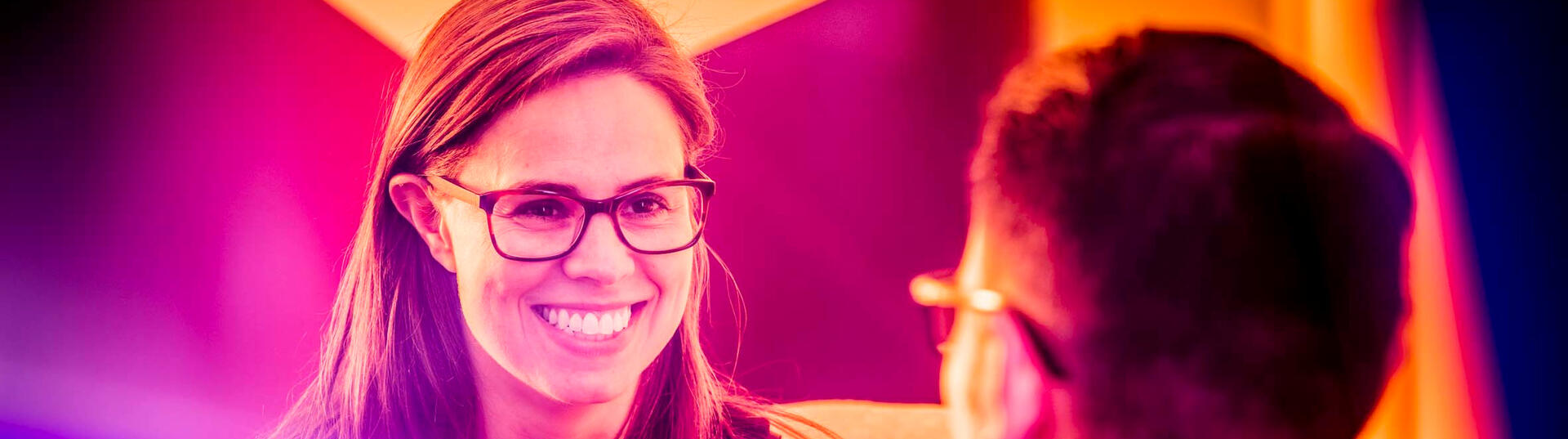 Woman smiling at a man