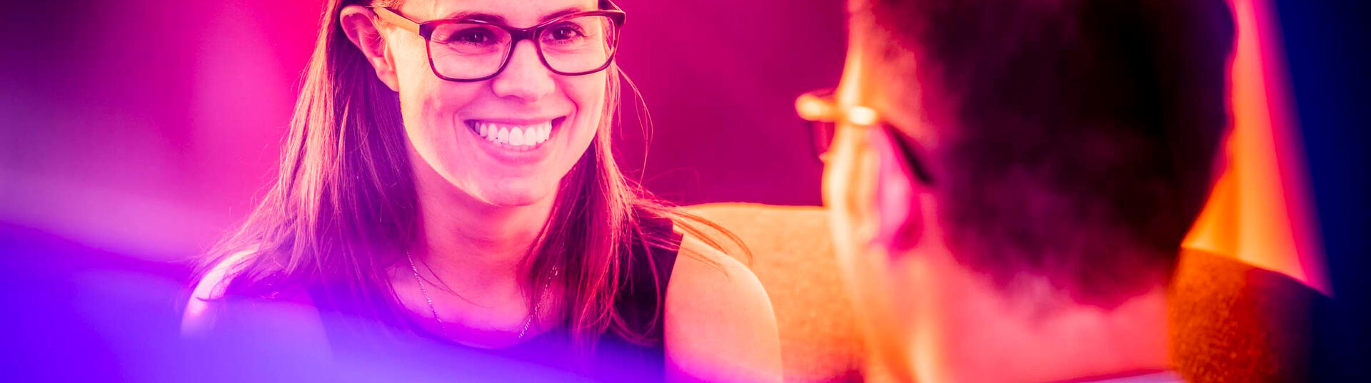 Woman smiling at a man