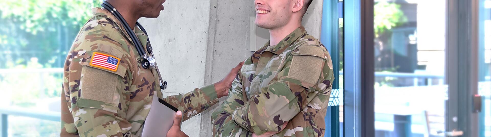 military doctor speaking with soldier