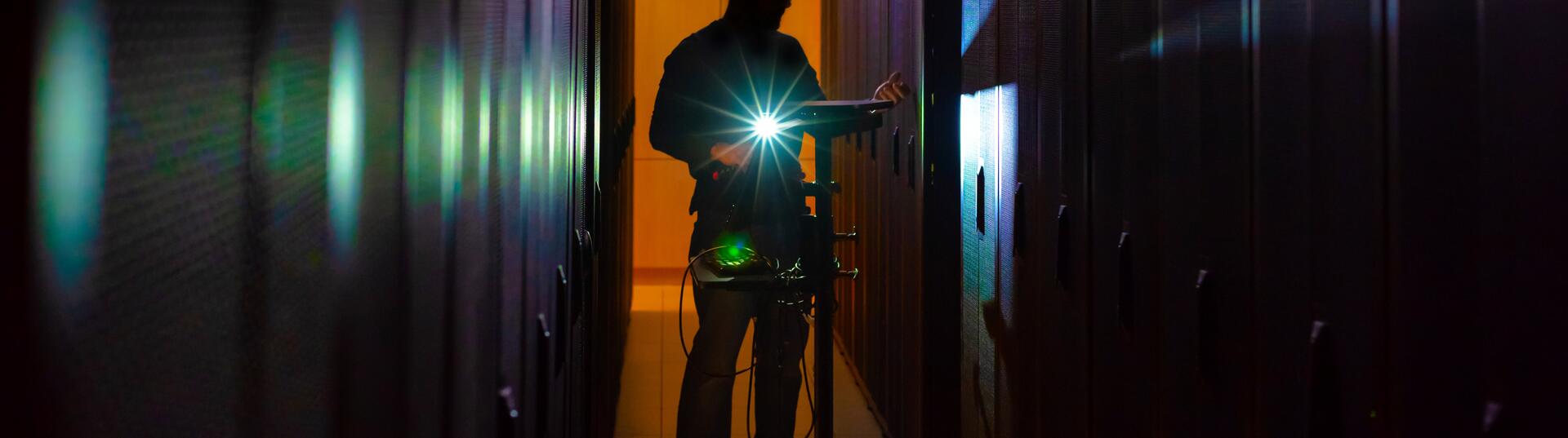 A man standing in a computer server
