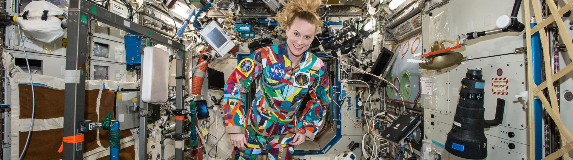 Kate Rubins with colorful space suit
