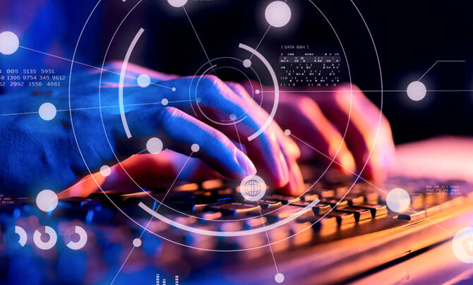 hands typing on keyboard