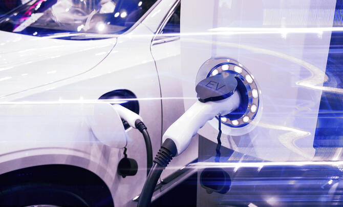 Close up of white EV charging port in use