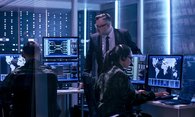 Team in uniforms working in a SCIF