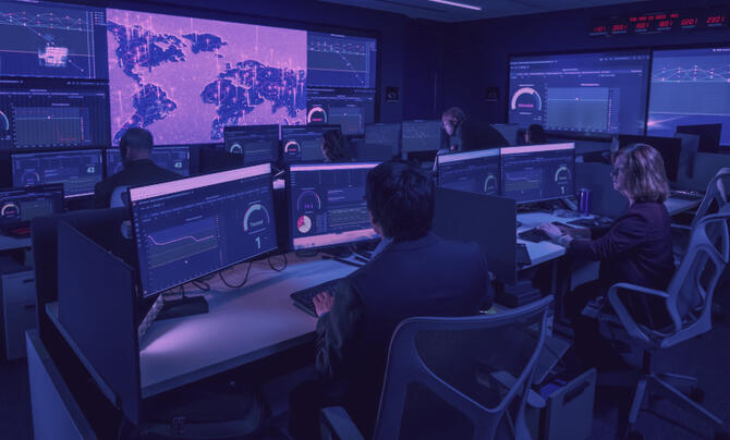 team working in a SCIF with multiple monitors