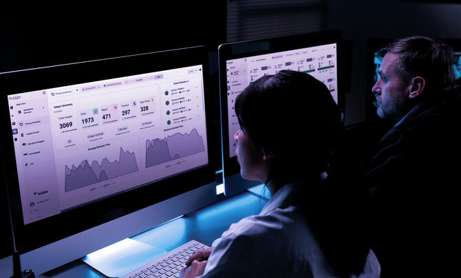 Security officers viewing screening dashboards