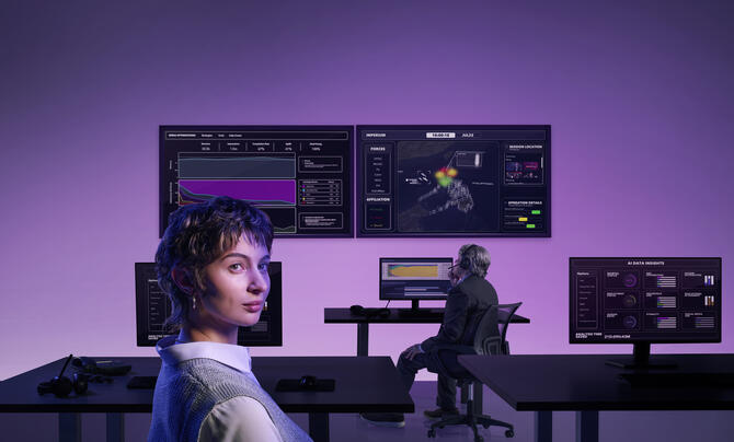 a women in front of computer screens with the imperium product