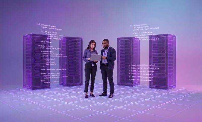 two people stand in front of servers