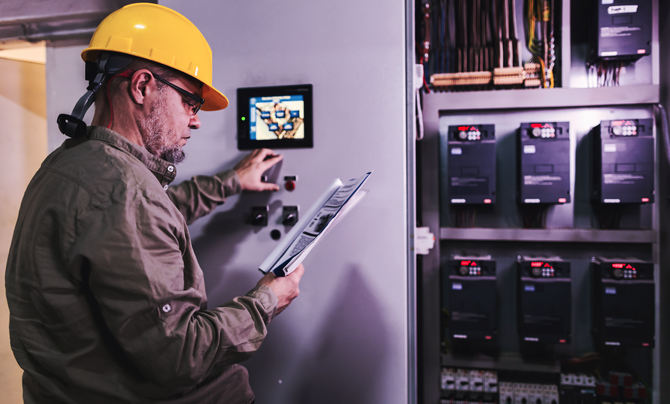 Engineer works on a control panel