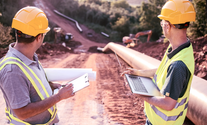 Engineers overseeing oil and gas asset integrity and compliance