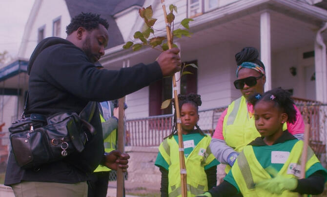 A family plant a tree