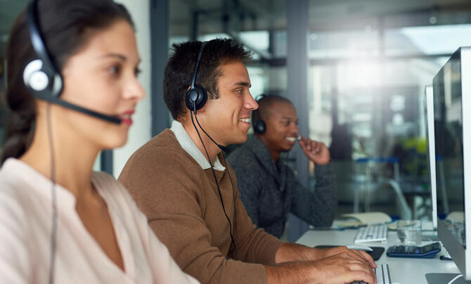 Shot of call center agents working in an office