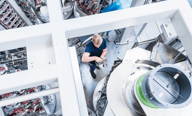 women working on machine