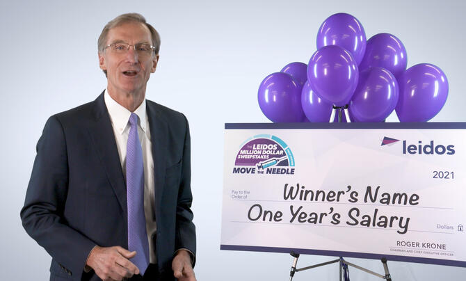 Roger Krone with winner's check