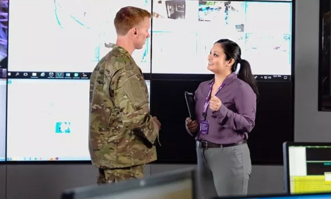 IT employee talking with military customer