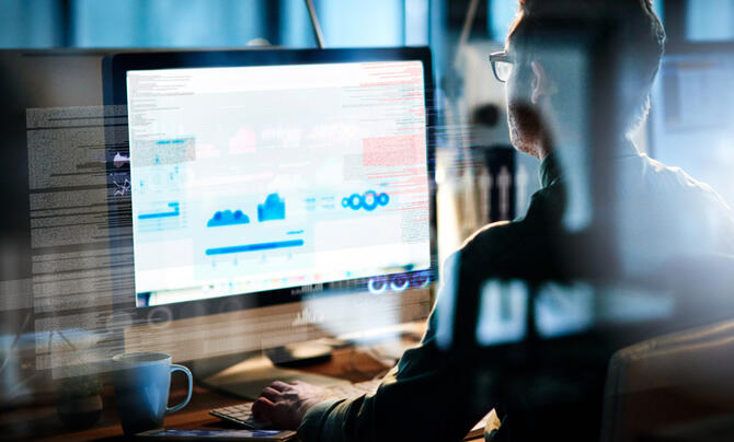man at computer working