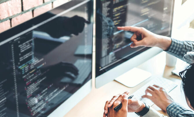 Users at work on dual monitors