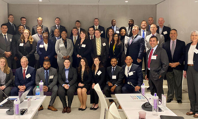 group picture of attendees at Leidos-hosted Hiring Our Heroes huddle