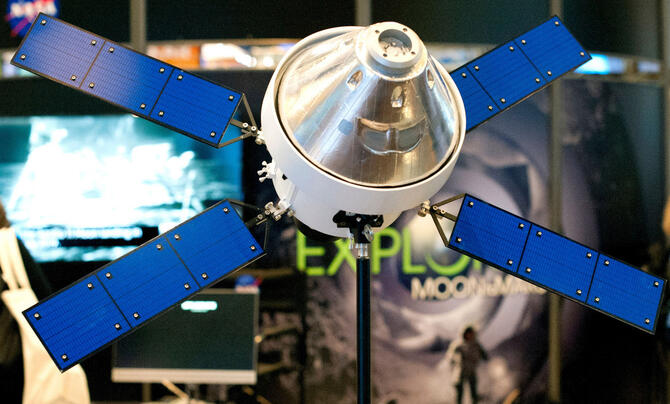 photo of a satellite model of the Orion capsule