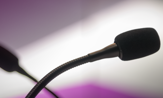 two podcast microphones crossed 